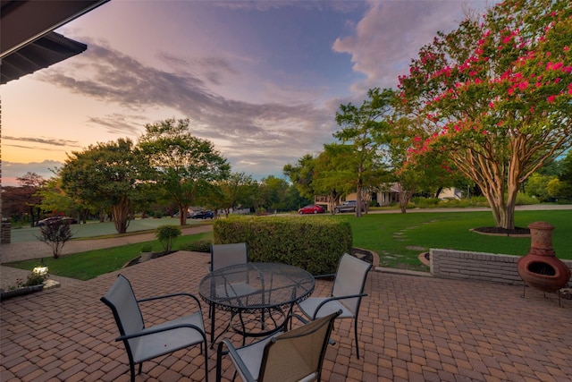 patio terrace at dusk with a lawn