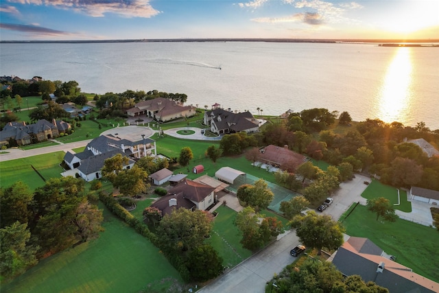 aerial view at dusk with a water view