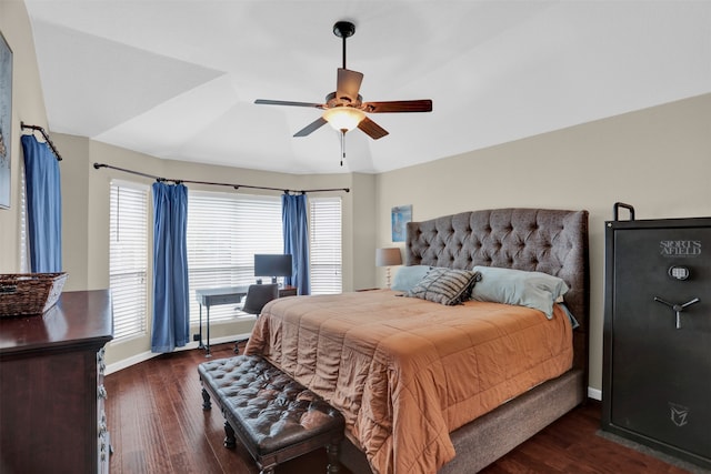 bedroom with dark hardwood / wood-style floors and ceiling fan