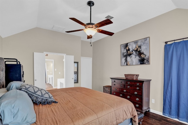 bedroom with ensuite bath, lofted ceiling, dark wood-type flooring, and ceiling fan