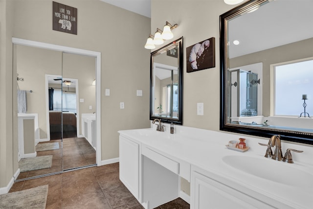 bathroom with vanity, a shower with shower door, and tile patterned flooring