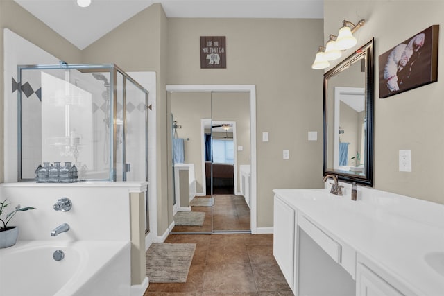 bathroom featuring vanity, independent shower and bath, and tile patterned flooring