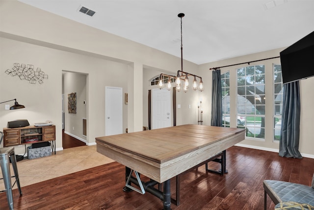 dining space with hardwood / wood-style flooring