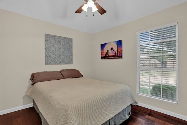 bedroom featuring dark hardwood / wood-style flooring and ceiling fan