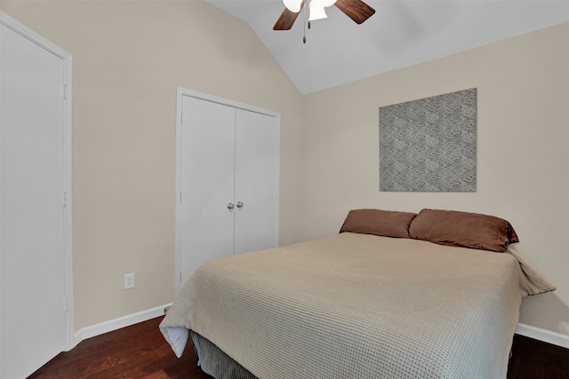 bedroom with lofted ceiling, dark wood-type flooring, a closet, and ceiling fan