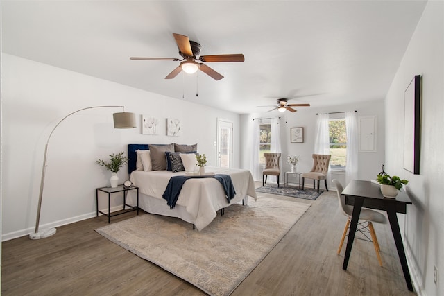 bedroom with ceiling fan and wood-type flooring