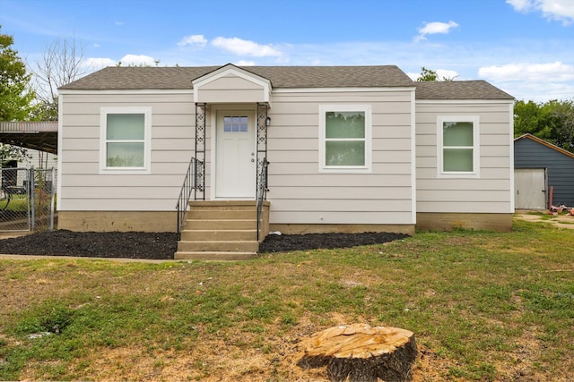 view of front of home with a front lawn