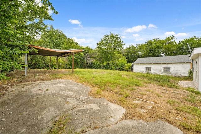 view of yard featuring a carport