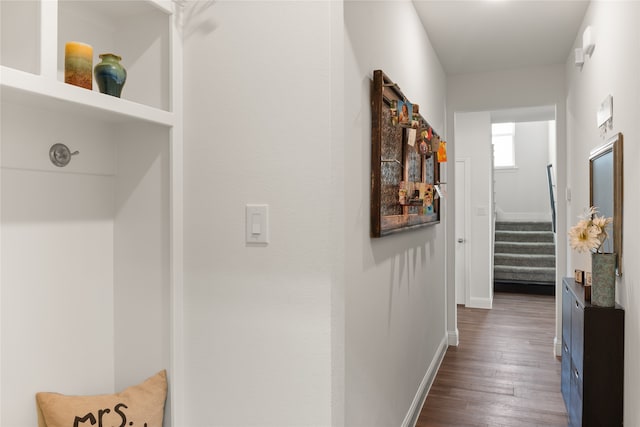 hall with dark wood-type flooring