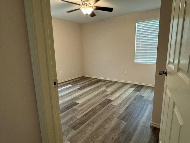 empty room with hardwood / wood-style flooring and ceiling fan