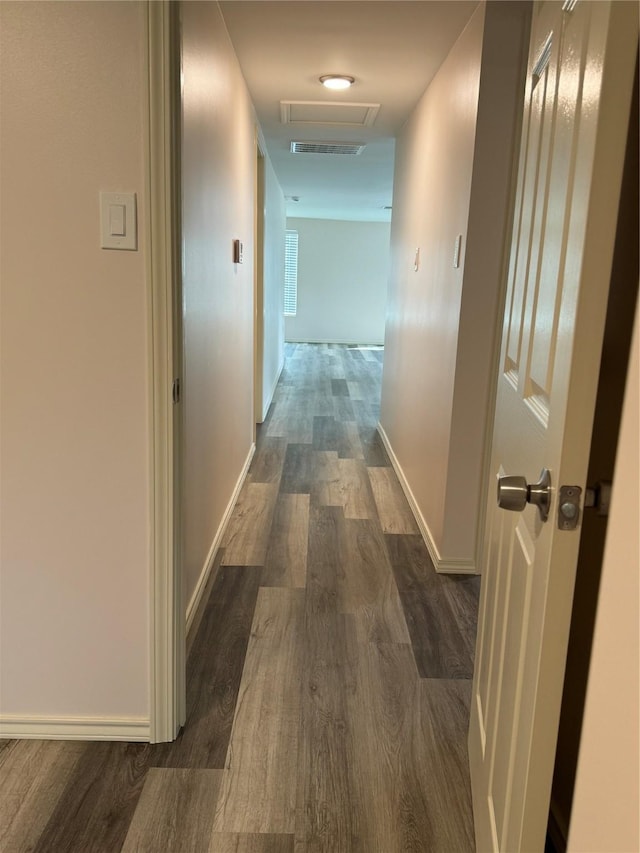 corridor featuring dark hardwood / wood-style flooring