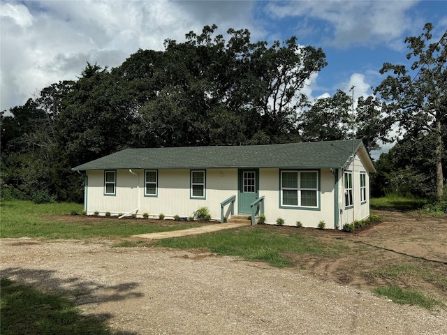 ranch-style home with a front yard