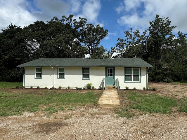 ranch-style home with a front yard