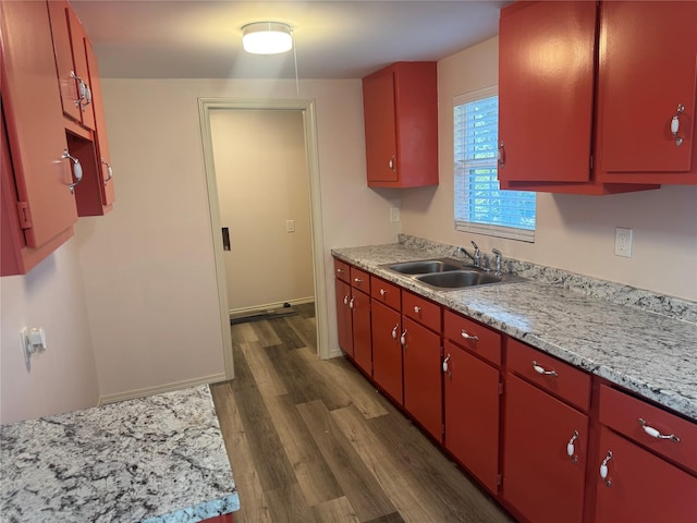 kitchen with sink and dark hardwood / wood-style floors