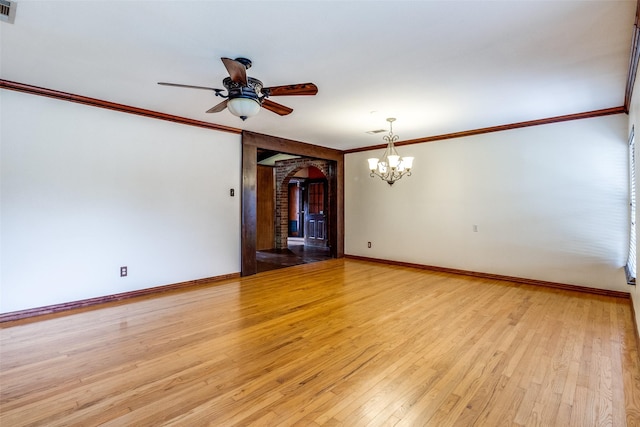 unfurnished room with ornamental molding, ceiling fan with notable chandelier, and light wood-type flooring