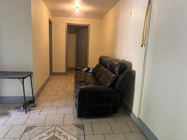 sitting room featuring light tile patterned floors