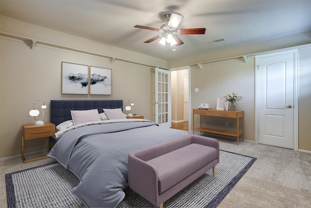 bedroom with light colored carpet and ceiling fan