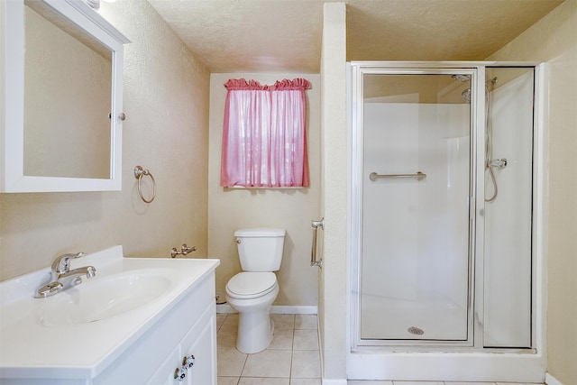 bathroom with a shower with door, toilet, vanity, and a textured ceiling