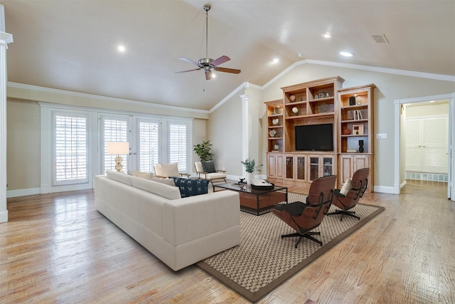 living room with crown molding, vaulted ceiling, light hardwood / wood-style flooring, and ceiling fan