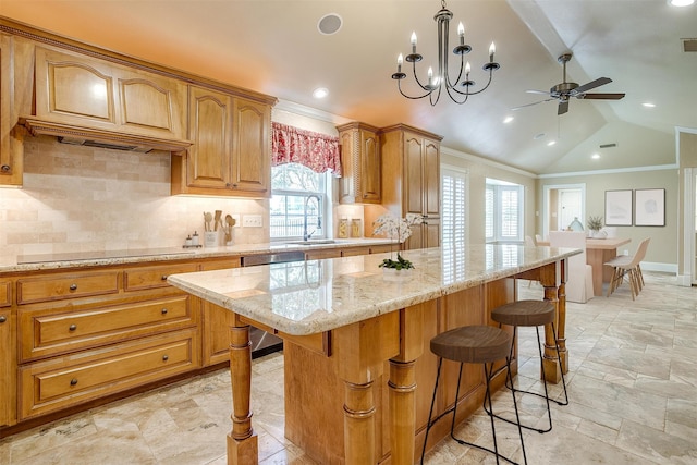 kitchen featuring dishwashing machine, hanging light fixtures, decorative backsplash, a kitchen island, and lofted ceiling