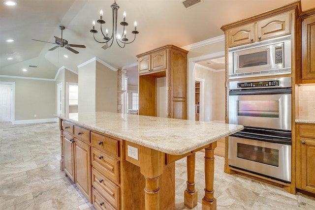 kitchen featuring ceiling fan with notable chandelier, crown molding, light stone countertops, appliances with stainless steel finishes, and lofted ceiling