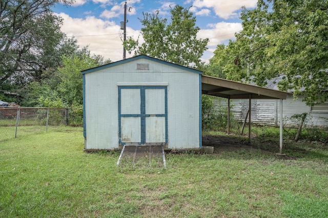 view of outdoor structure with a lawn