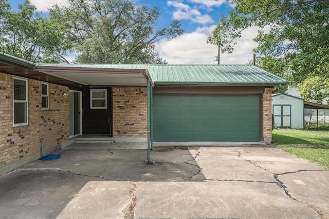 view of front of house featuring a garage and an outdoor structure