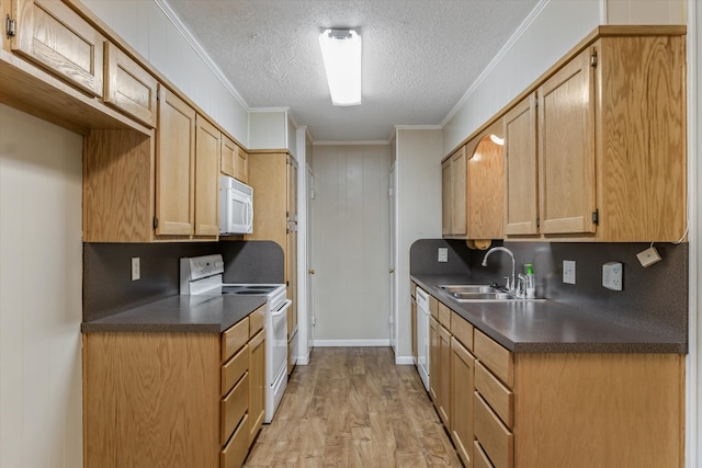 kitchen with white appliances, sink, crown molding, light wood-type flooring, and a textured ceiling