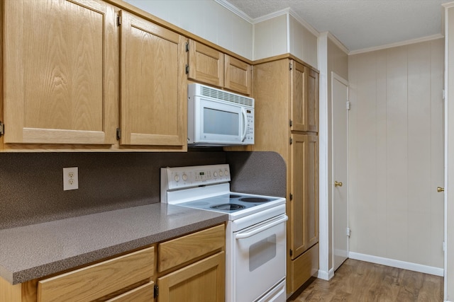 kitchen featuring light hardwood / wood-style floors, light brown cabinetry, crown molding, and white appliances