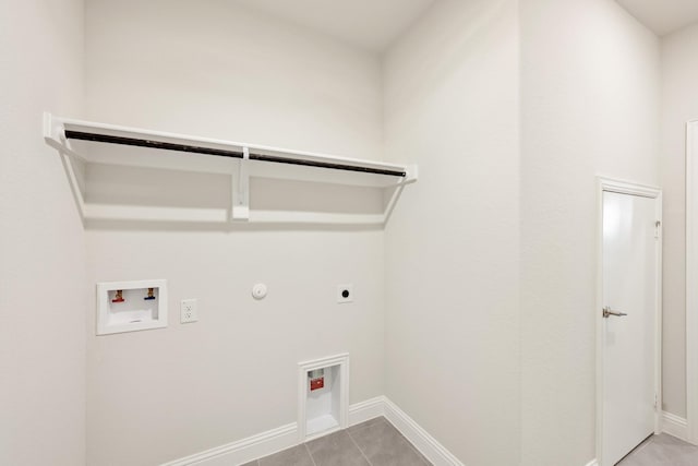 laundry area featuring electric dryer hookup, washer hookup, hookup for a gas dryer, and light tile patterned floors