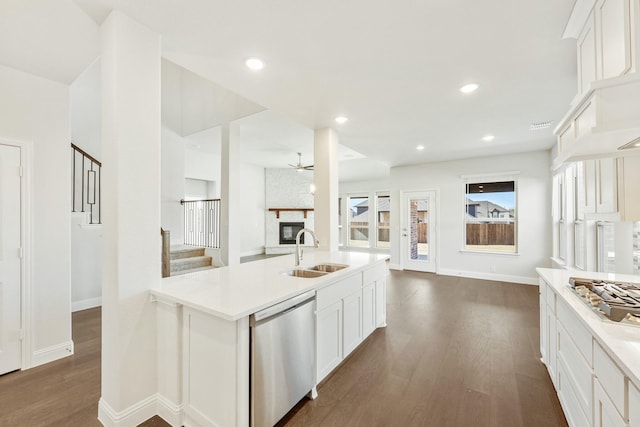 kitchen featuring white cabinetry, sink, dark wood-type flooring, and stainless steel appliances