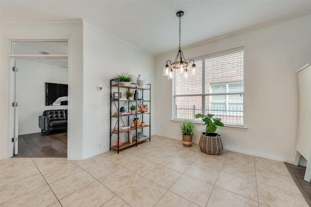 tiled dining room with crown molding and an inviting chandelier