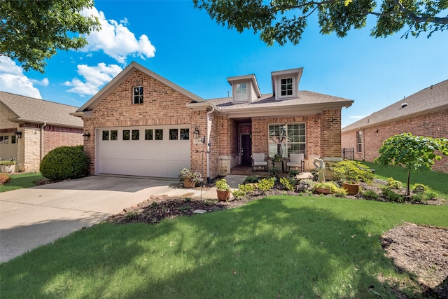 view of front of house featuring a garage and a front yard