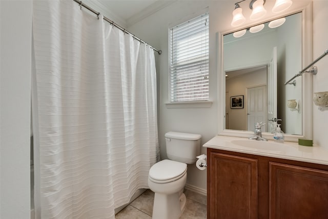 bathroom featuring vanity, tile patterned floors, ornamental molding, and toilet