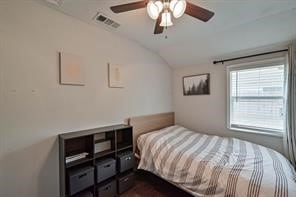 bedroom featuring ceiling fan and vaulted ceiling