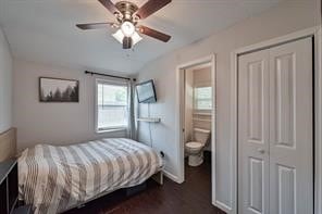 bedroom featuring connected bathroom, wood-type flooring, and ceiling fan