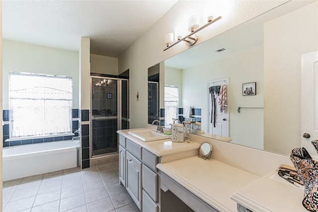 bathroom with vanity, tile patterned floors, and independent shower and bath