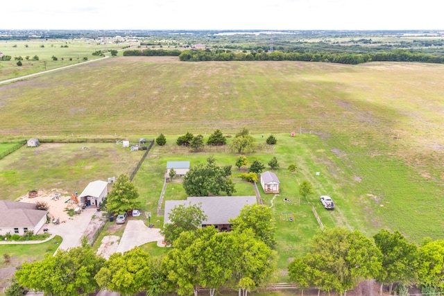 birds eye view of property with a rural view