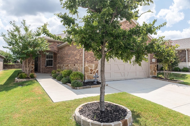 view of front of property with a garage and a front lawn