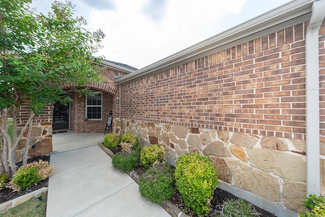 doorway to property with a patio area