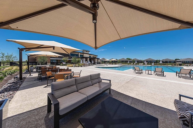 view of patio / terrace featuring a community pool and an outdoor living space