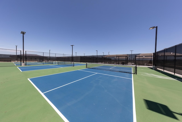 view of sport court featuring basketball hoop