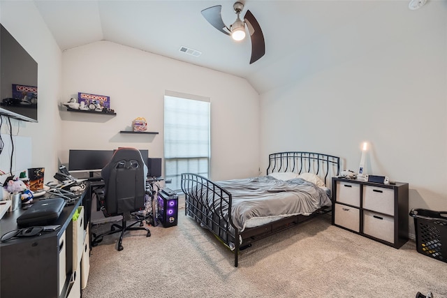 bedroom with lofted ceiling, light colored carpet, and ceiling fan