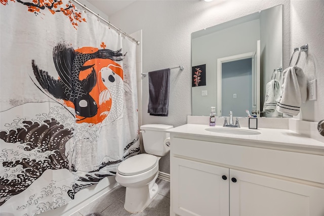 bathroom with vanity, tile patterned flooring, and toilet