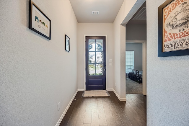 doorway to outside with dark hardwood / wood-style flooring