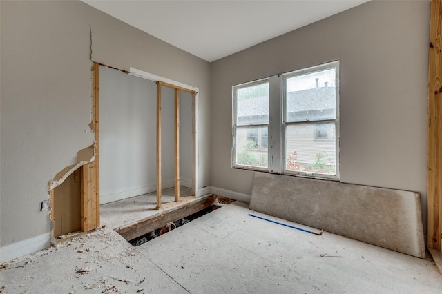 interior space featuring baseboards