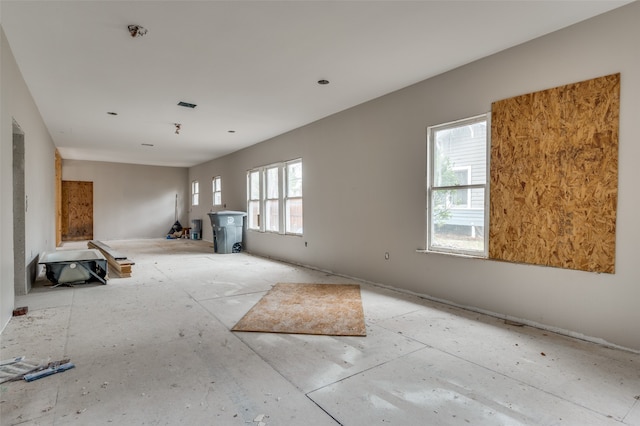 unfurnished living room featuring plenty of natural light