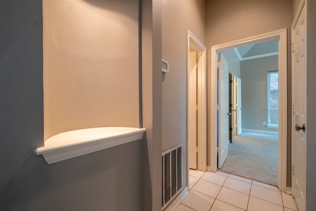 hallway featuring light tile patterned floors