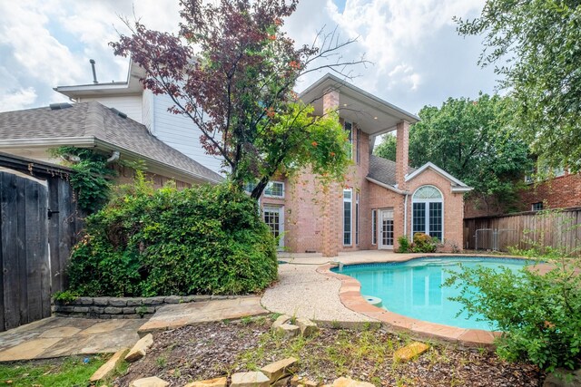 view of swimming pool with a patio