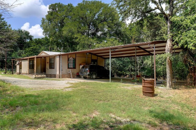 view of yard featuring a carport